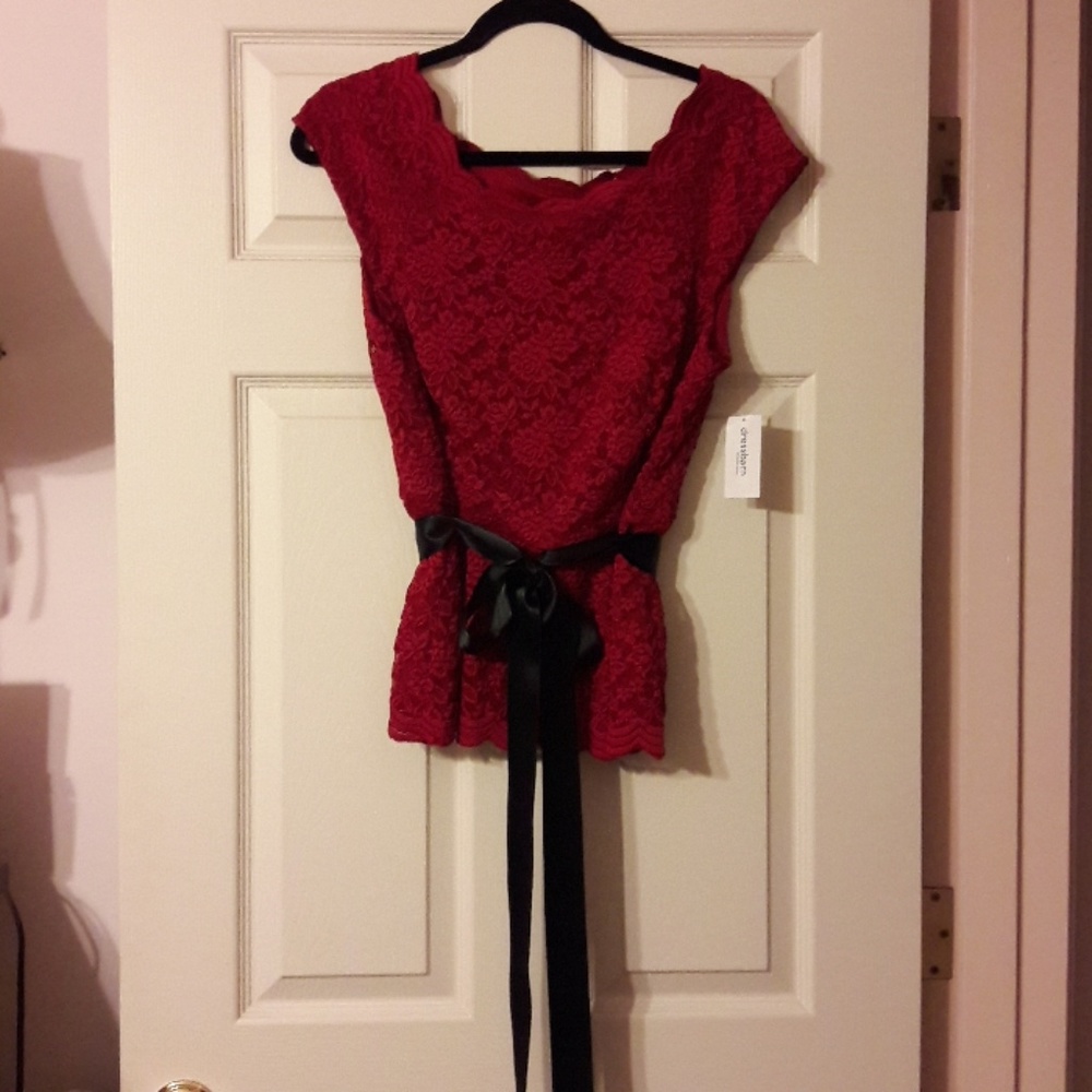 Red lace blouse with black satin bow